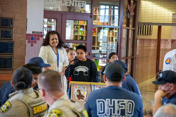 A boy addresses the crowd of first responders
